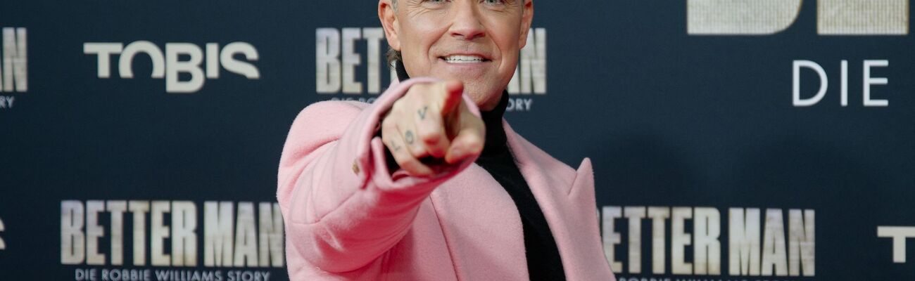 Robbie Williams bei der Premiere., © Henning Kaiser/dpa