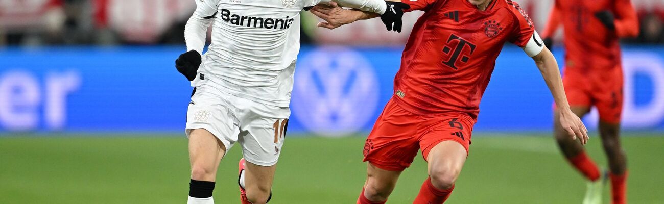 Am Samstag Gegner - irgendwann auch gemeinsam im Verein? Leverkusens Florian Wirtz (l) und Bayerns Joshua Kimmich., © Sven Hoppe/dpa